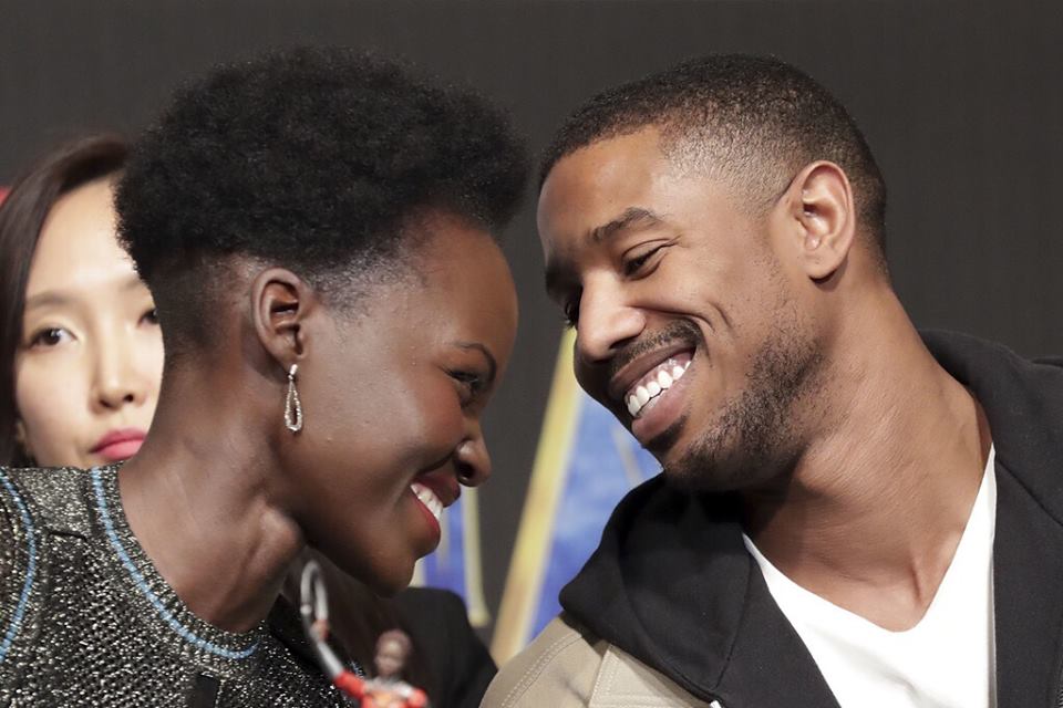 Lupita Nyong'o and Michael B. Jordan gaze at each other during the Korean press conference for Black Panther.