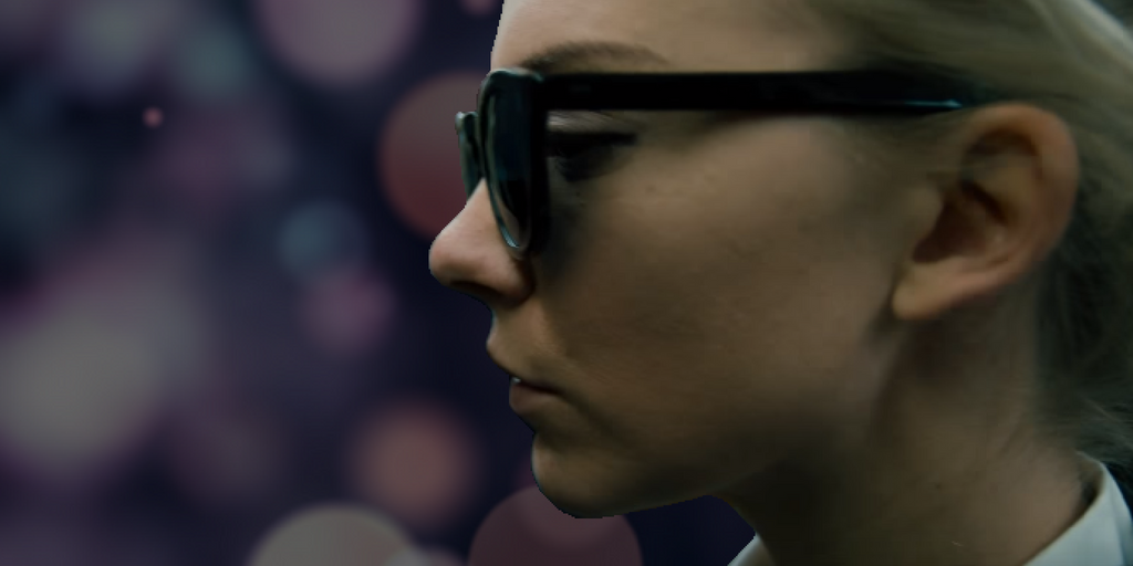 Illustration of Natalie Dormer as Sofia in 'In Darkness.' Behind her is a bokeh-esque background simulating blindness