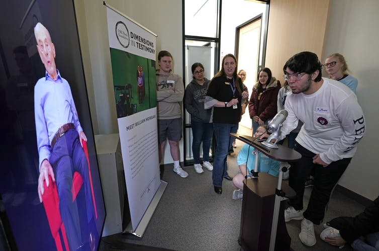 A student speaks with Holocaust survivor William Morgan using an interactive virtual conversation exhibit at the the Holocaust Museum Houston in January 2019. David J. Phillip/AP