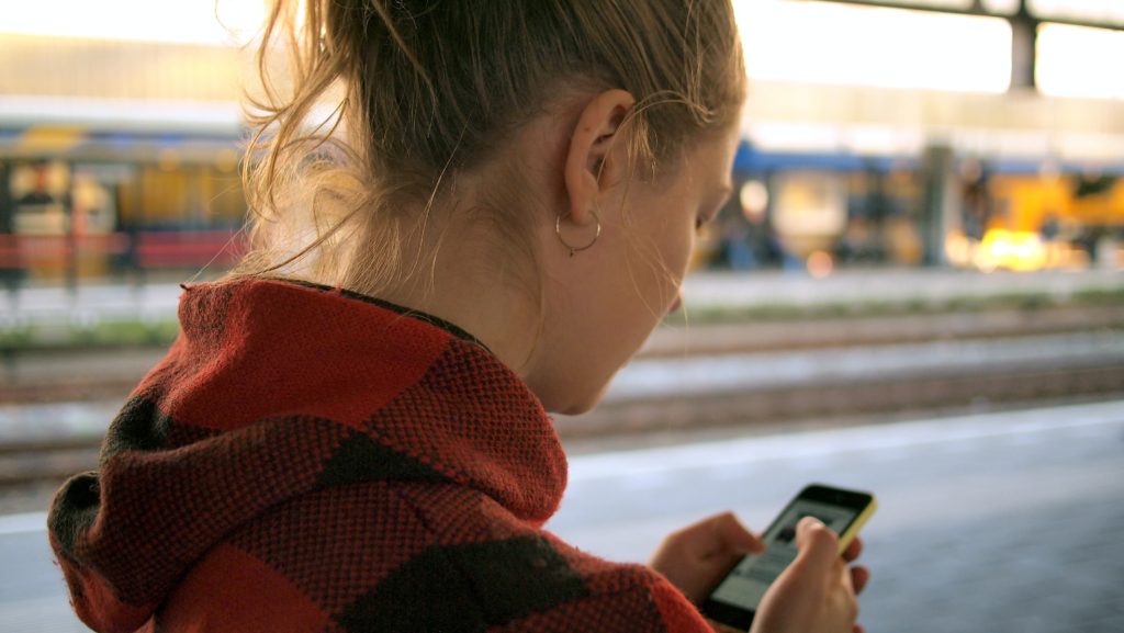 With permission, you can record someone being racist becuase of COVID-19 to help the targeted person document the encounter for authorities. Leiden Centraal, Leiden, Netherlands.
Checking Her Smartphone.