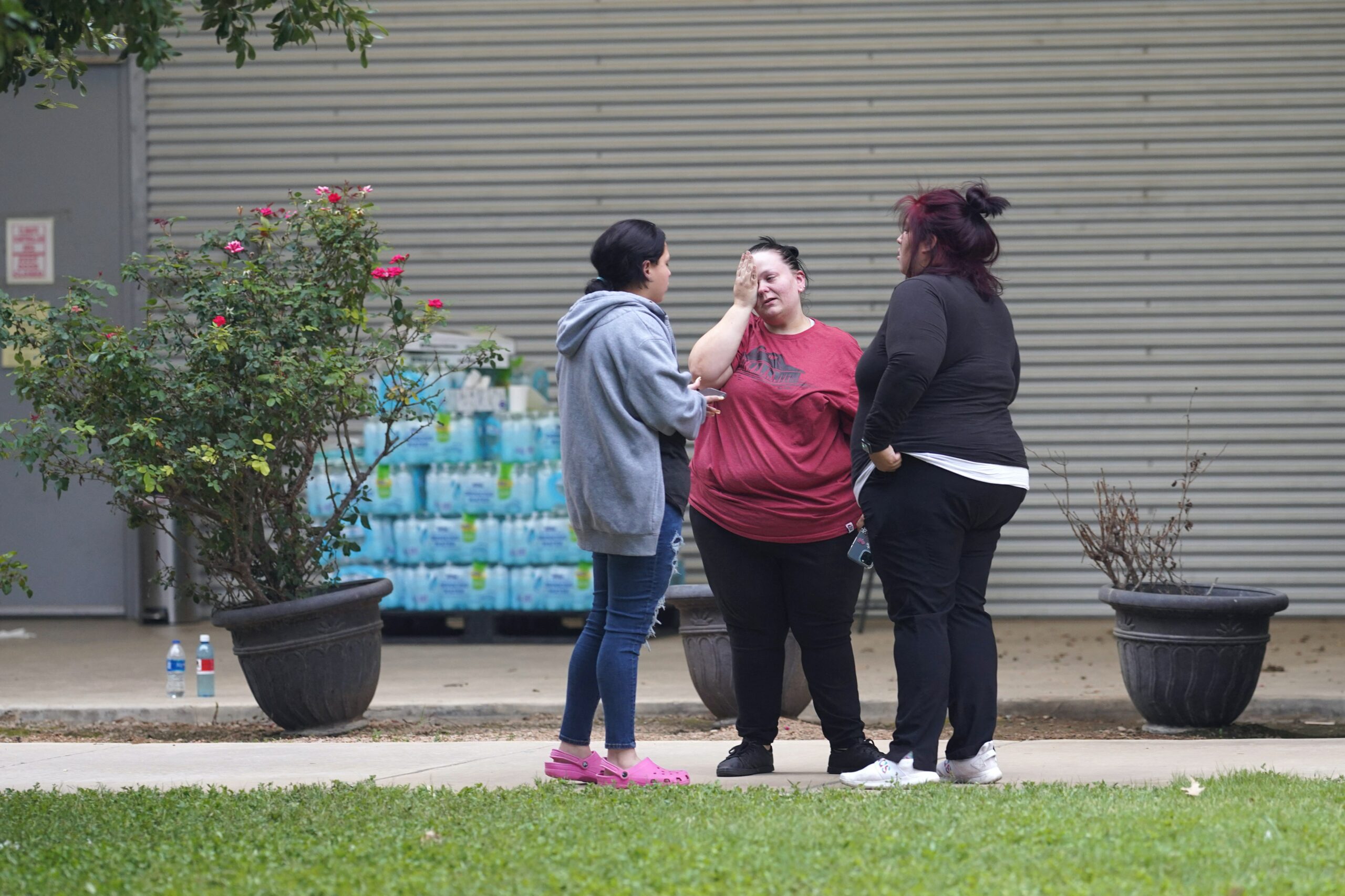 Friends and families gather outside the civic center after the mass school shooting on May 24, 2022, in Uvalde, Texas.