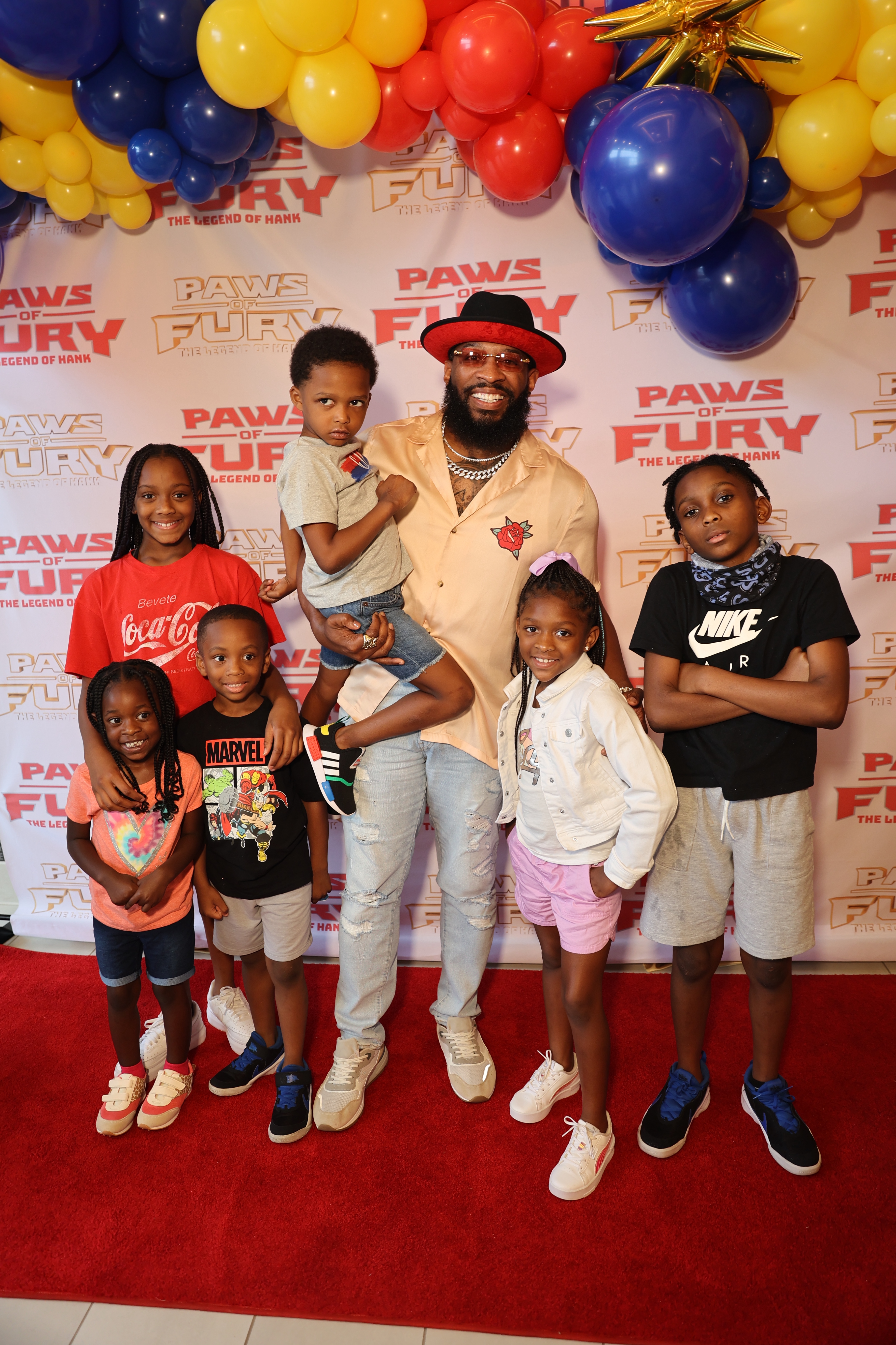 Pastor Mike Jr. with his family at Paws of Fury screening in Atlanta. (Photo credit: Freddy O)