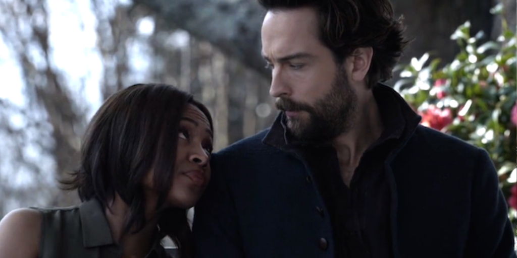 Abbie (Nicole Beharie) leans against Ichabod's (Tom Mison) shoulder. 