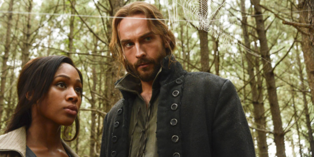 Abbie (Nicole Beharie) and Ichabod (Tom Mison) looking at a spider's web. 