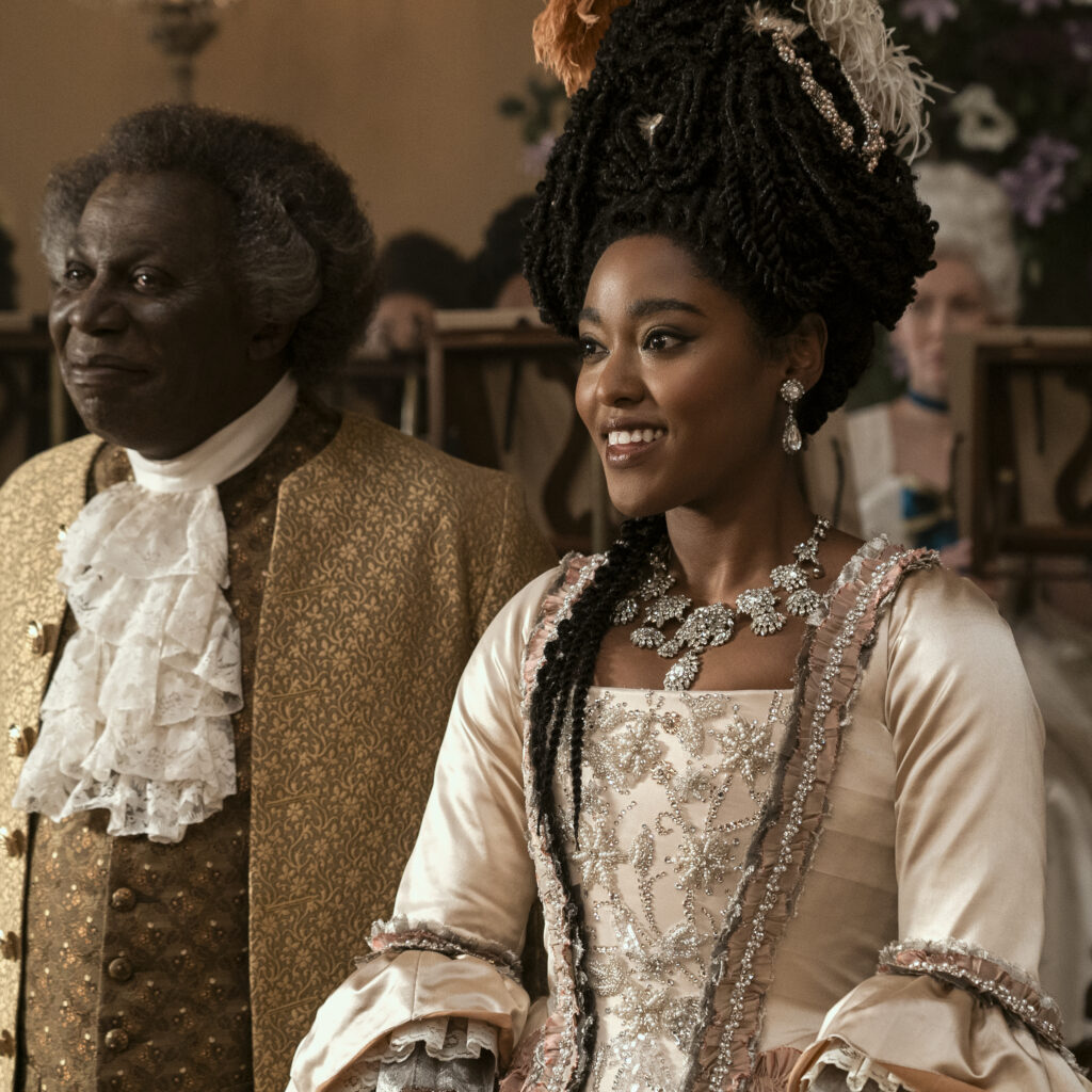 Queen Charlotte: A Bridgerton Story. (L to R) Cyril Nri as Lord Danbury, Arsema Thomas as Young Agatha Danbury in episode 103 of Queen Charlotte: A Bridgerton Story. Cr. Liam Daniel/Netflix © 2023