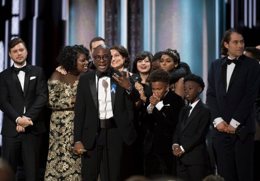 Director Barry Jenkins and the cast and crew of "Moonlight" celebrating their Oscar win onstage after a surprising mix-up. (ABC/Eddy Chen)
