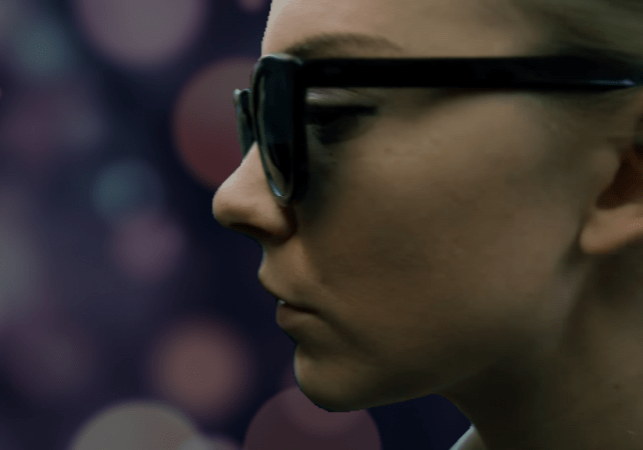 Illustration of Natalie Dormer as Sofia in 'In Darkness.' Behind her is a bokeh-esque background simulating blindness