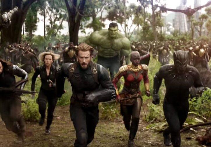 Winter Soldier, Black Widow, Captain America, Okoye, Black Panther and the Hulk are running with Wakanda's forces through the Wakandan Savannah towards danger.