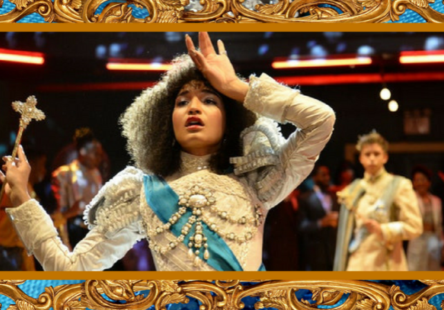 Cerulean satin and a gilded gold frame houses a picture of Indya Moore as Angel