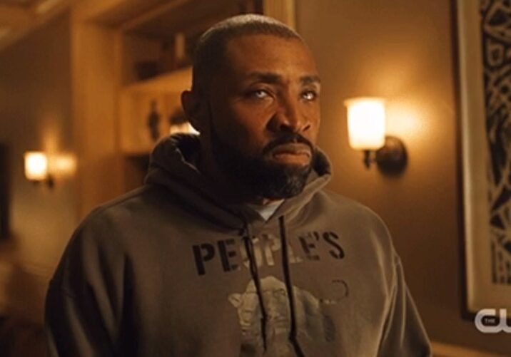 Jefferson Pierce (Cress Williams) wearing the dark grey People's Free Food Program hoodie.