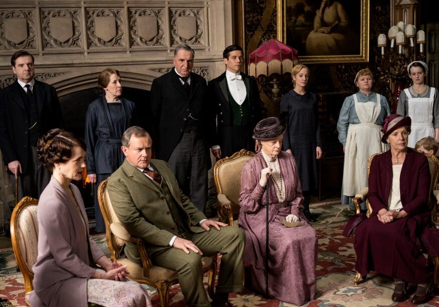 Downton Abbey, Season 5
MASTERPIECE on PBS
Sundays, January 4 - March 1, 2015 at 9pm ET

Episode 2

Rose hits on a strategy to get a radio in the house. Sarah tutors Daisy. An art historian arrives.
Anna makes a difficult purchase.

SHOWN: BRENDAN COYLE as John Bates, ELIZABETH McGOVERN as Cora, Countess of Grantham, PHYLLIS LOGAN as Mrs Hughes, HUGH BONNEVILLE as Robert, Earl of Grantham, JIM CARTER as Mr Carson, ROBERT JAMES-COLLIER as Thomas, MAGGIE SMITH as Violet, Dowager Countess of Grantham, JOANNE FROGGATT as Anna, LESLEY NICOL as Mrs Patmore, PENELOPE WILTON as Isobel Crawley and SOPHIE McSHERA as Daisy

(C) Nick Briggs/Carnival Film &amp; Television Limited 2014 for MASTERPIECE

This image may be used only in the direct promotion of MASTERPIECE CLASSIC. No other rights are granted. All rights are reserved. Editorial use only. USE ON THIRD PARTY SITES SUCH AS FACEBOOK AND TWITTER IS NOT ALLOWED.