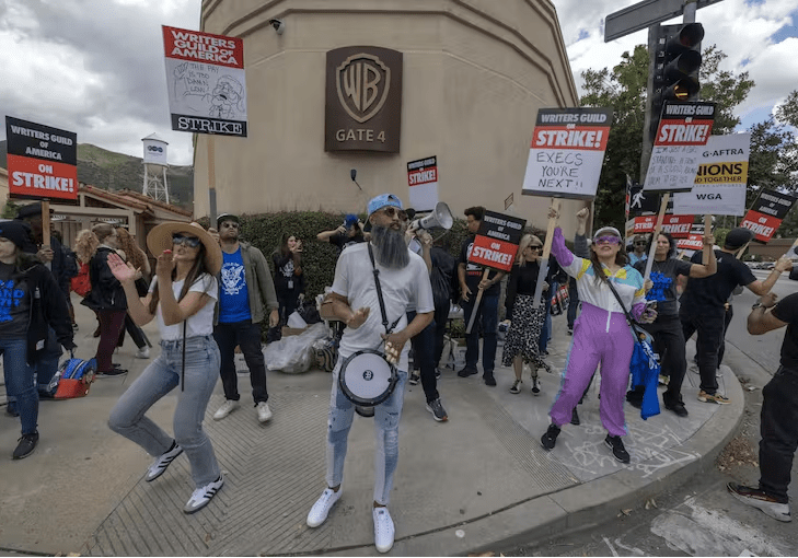 Striking workers picket outside of Warner Bros. Studios on the second day of the Hollywood writers strike on May 3, 2023, in Burbank, Calif. (David McNew/Getty Images)